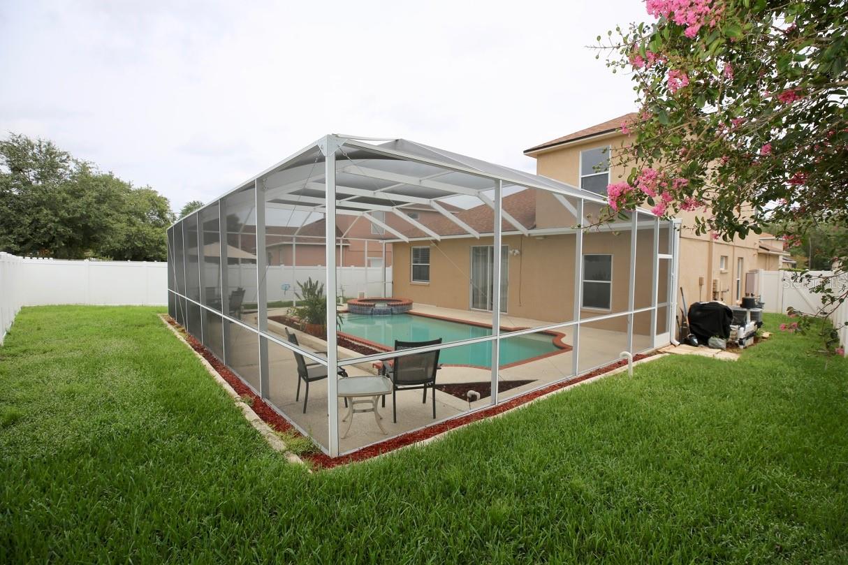back yard and screened enclosure