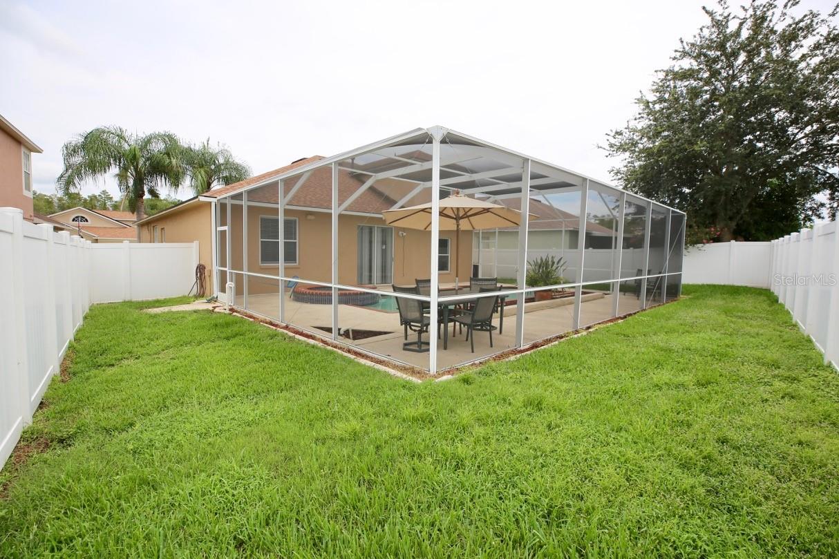 back yard and screened enclosure