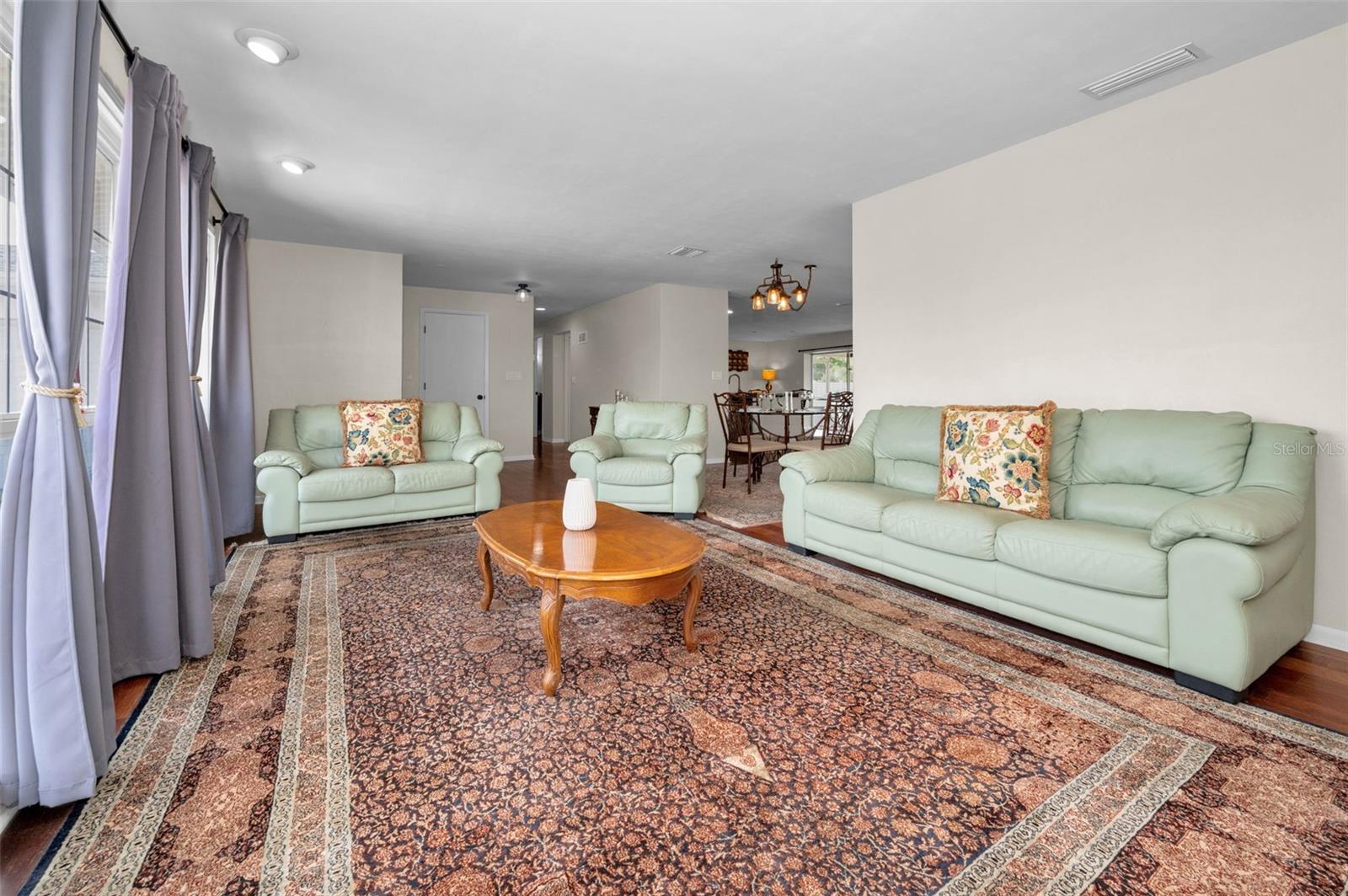 .. Living Room Looking Out Towards the Interior of Home. . The Natural Light is Wonderful in this Area.