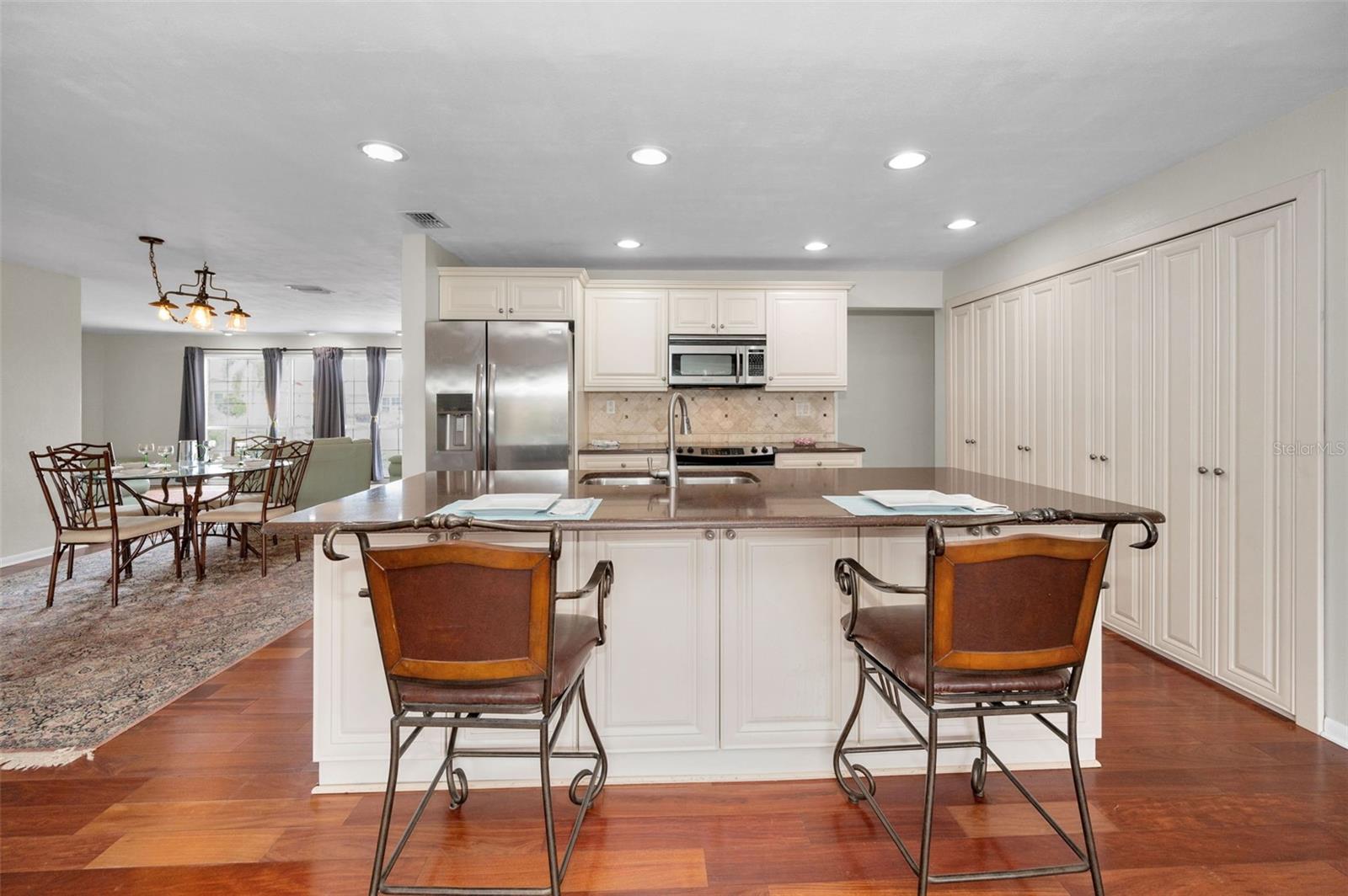 .. Kitchen Shot with Large Dining / Breakfast Bar. NOTE: Oodles of Storage and Cabinet Space .. Fantastic Layout For Entertaining.