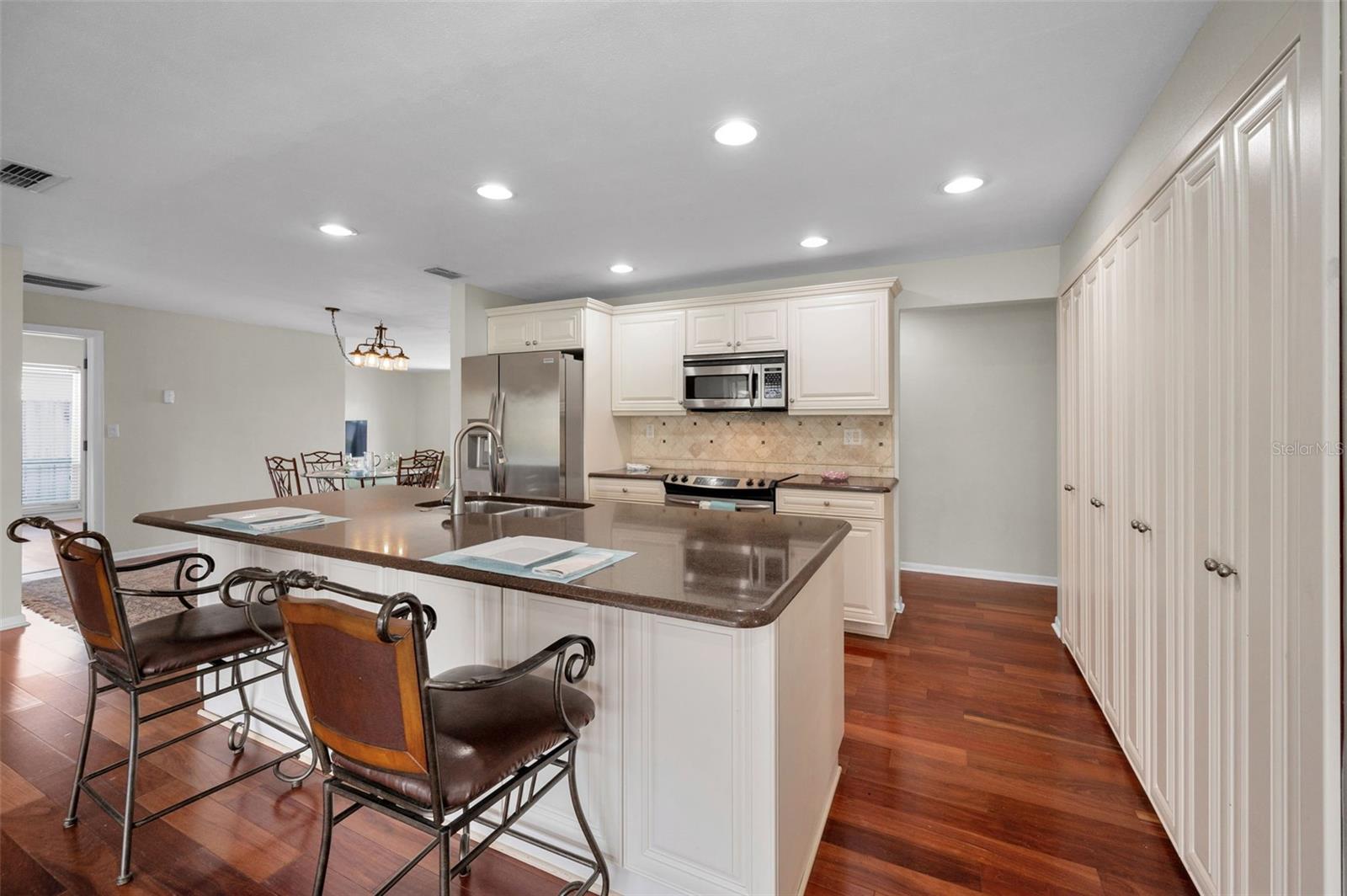 ...Photo Showcasing Open Kitchen with Large Dining / Breakfast Bar...  Kitchen Shot #5..