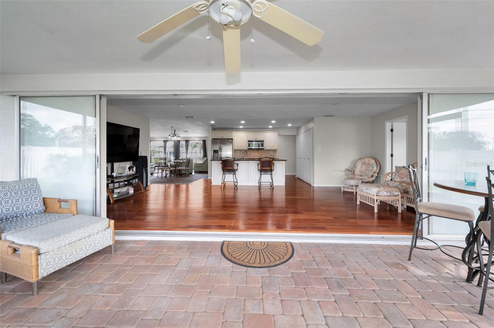 ... Looking In to Family Room From the 23.5 X 10 Screened Florida Room.