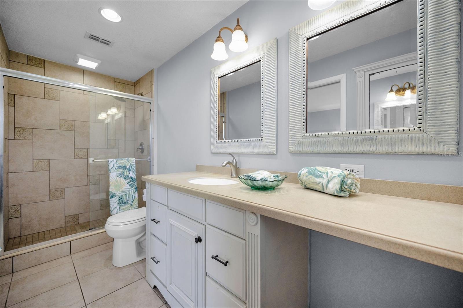 .. Master Bath .. Walk in Shower. Extended countertop that provides seating space for grooming.
