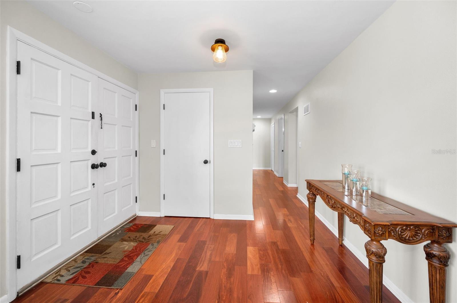 .. Entrance Foyer with Coat Closet. Beautiful Cherry Wood Runs Thru Out all Living Areas.