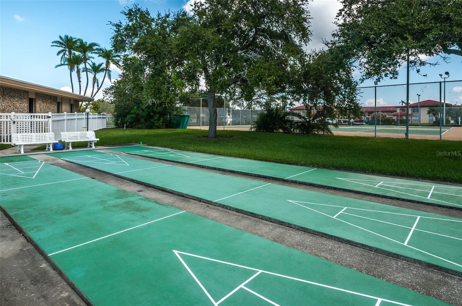 ... Shuffle Board With Tennis Courts in The Background..