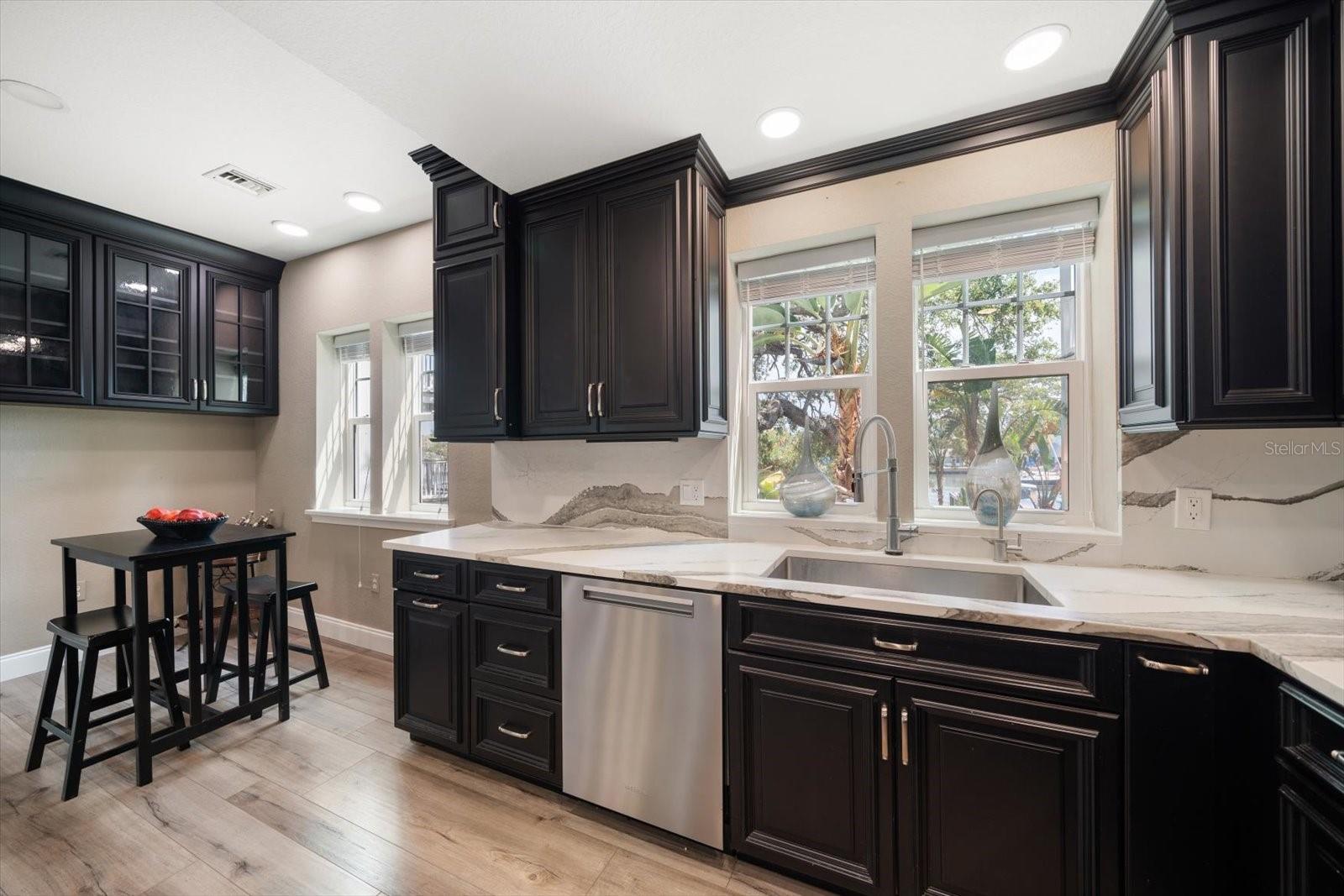 Fully equipped kitchen with newer appliances, Cambria stone counters and detailed cabinetry. Chefs will love entertaining and providing culinary experiences!