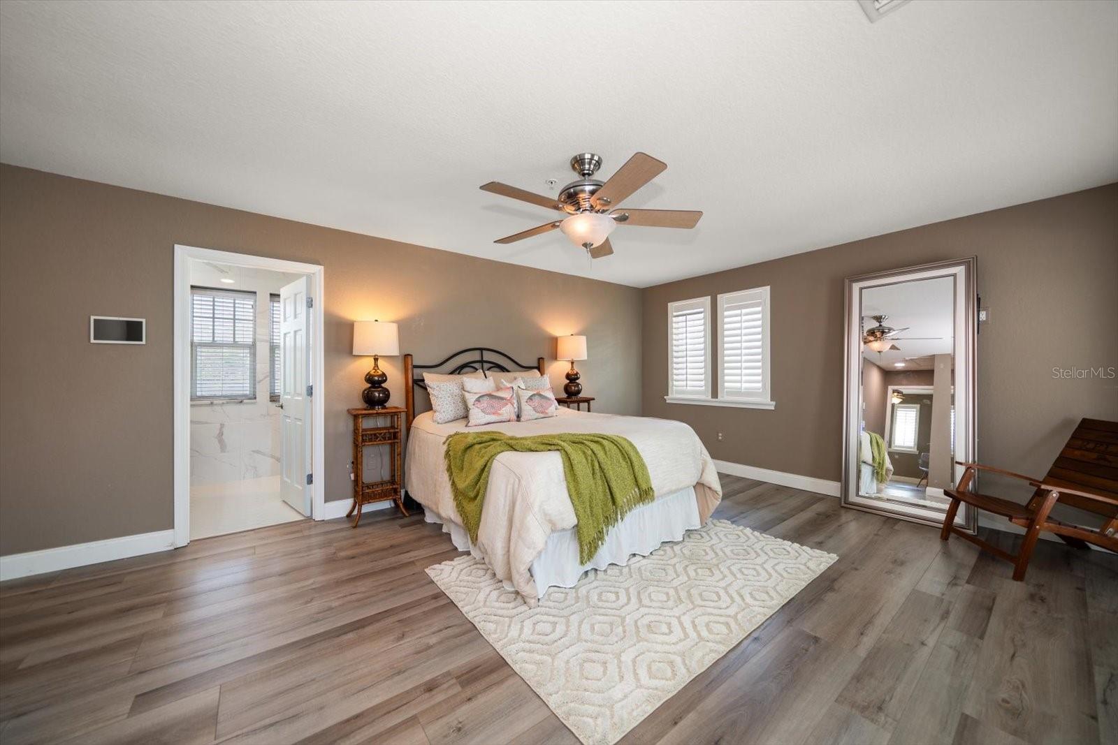 Primary suite with attractive maintenance free luxury planked flooring.