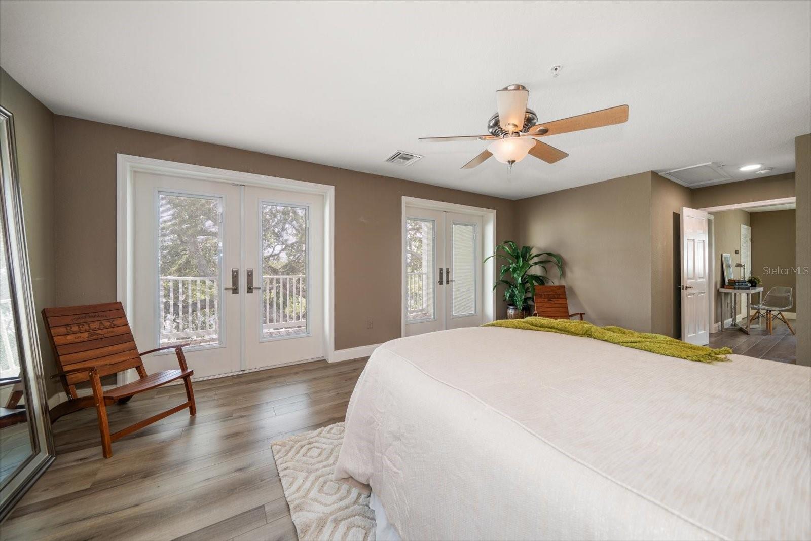 Primary suite has double French door entry to private terrace.