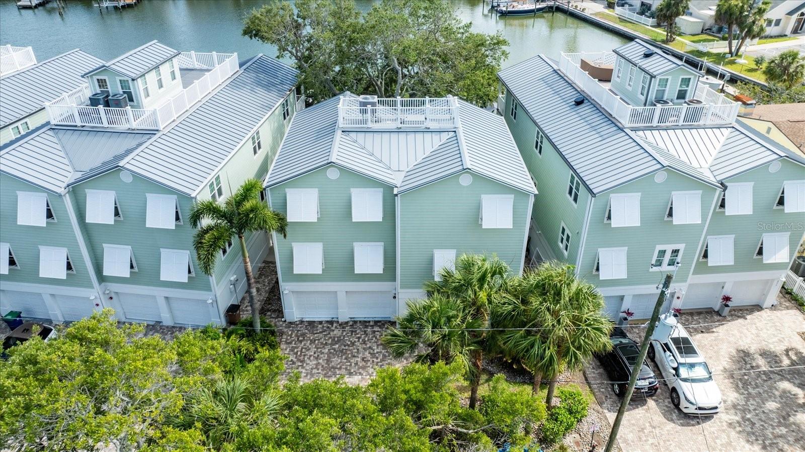 Situated in the middle of townhomes, this free standing residence offers so much for those who love to live by the water!