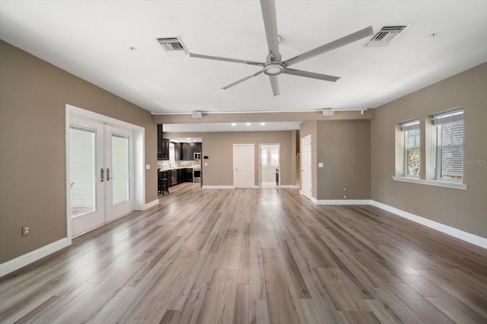 Attractive flooring accentuates the great room so versatile for various lifestyles.