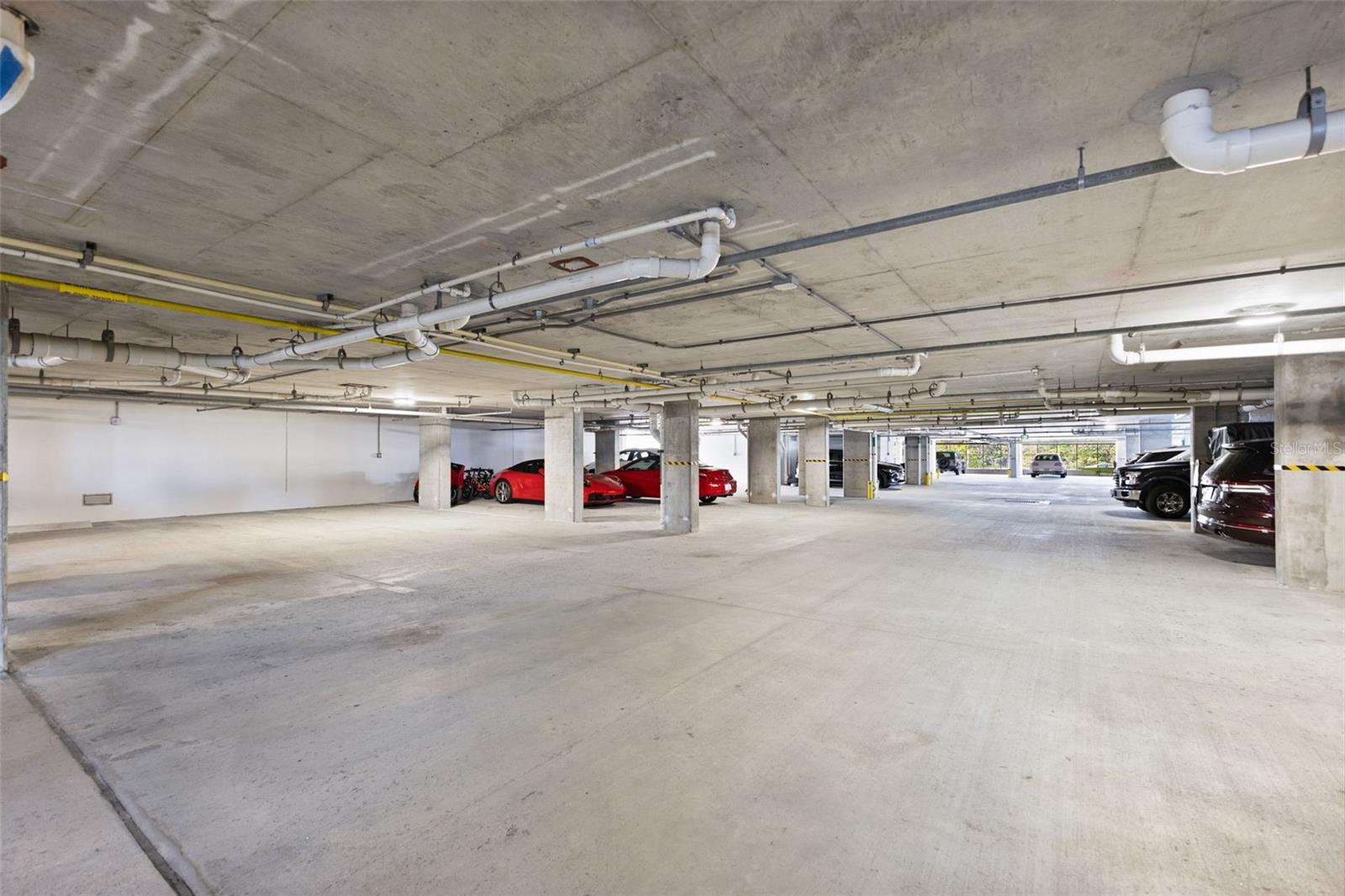 Under building parking (2 spaces with unit plus 1 space in lot adjacent to bldg)
