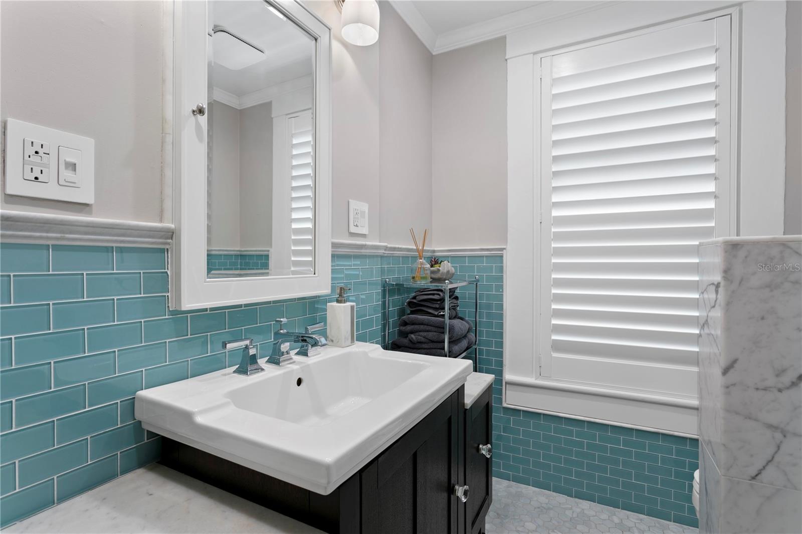 Updated full bathroom shared by the second and third bedrooms