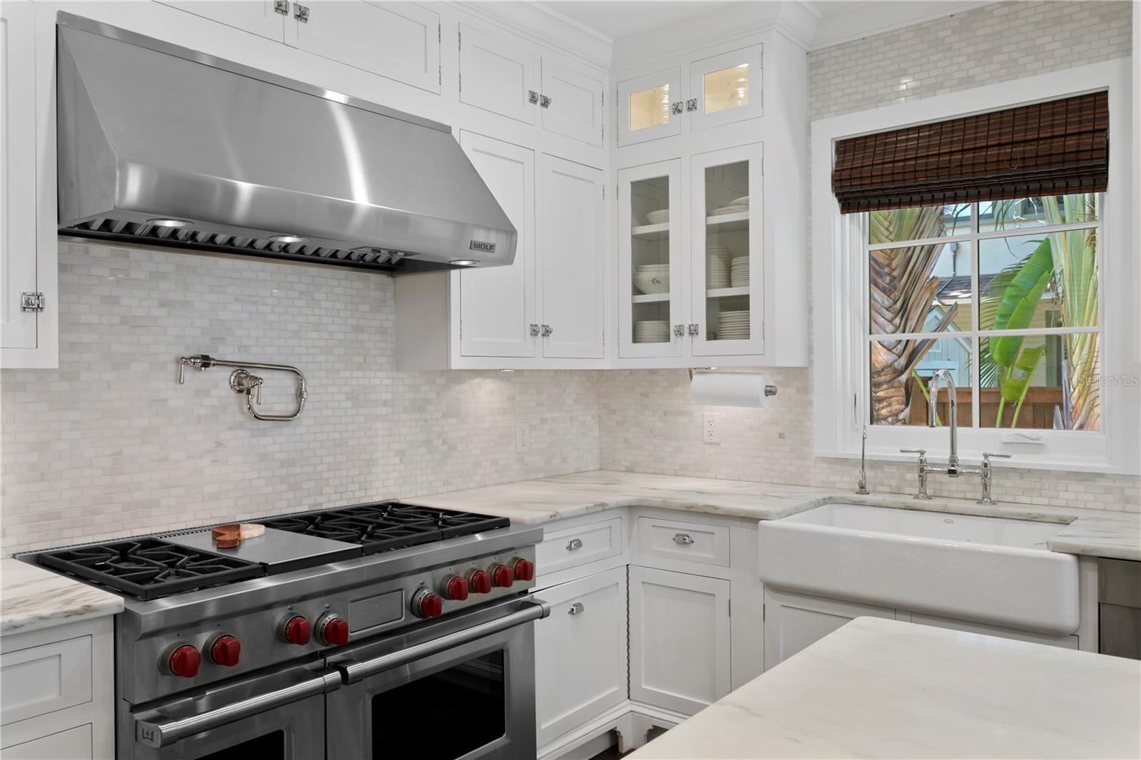 Wolf gas range and large farmhouse sink