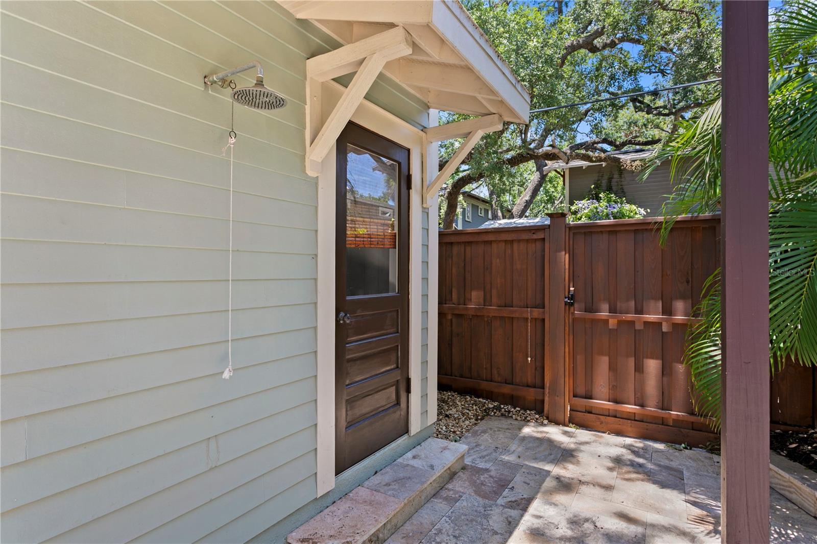 Outdoor pool shower and half bathroo