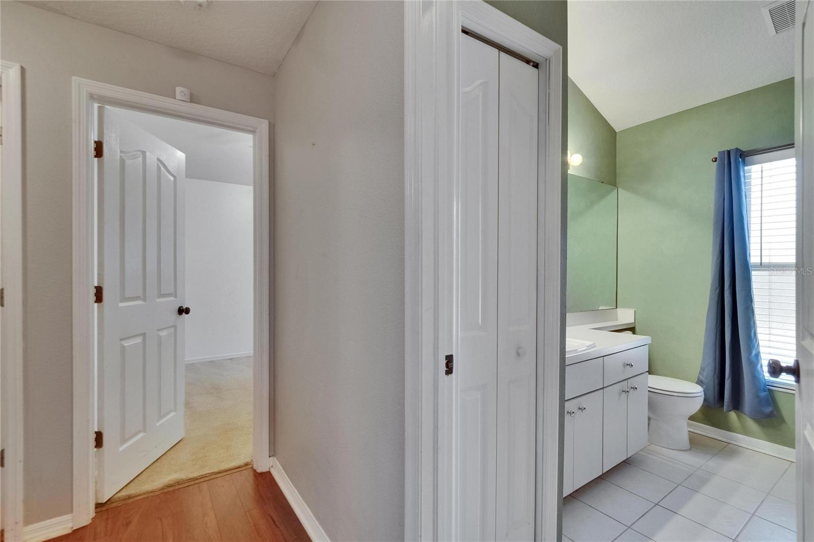 Secondary Bathroom and 1 of 3 Secondary Bedrooms to the Left