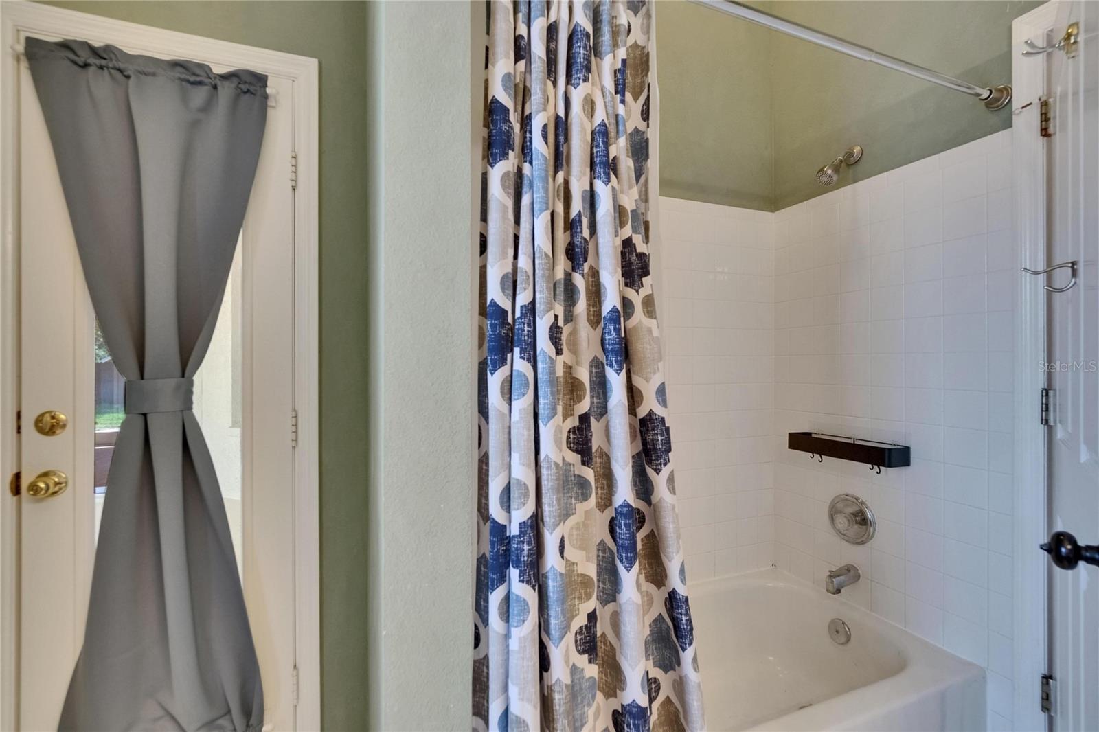 2nd Bath.  Door to Lanai to Left