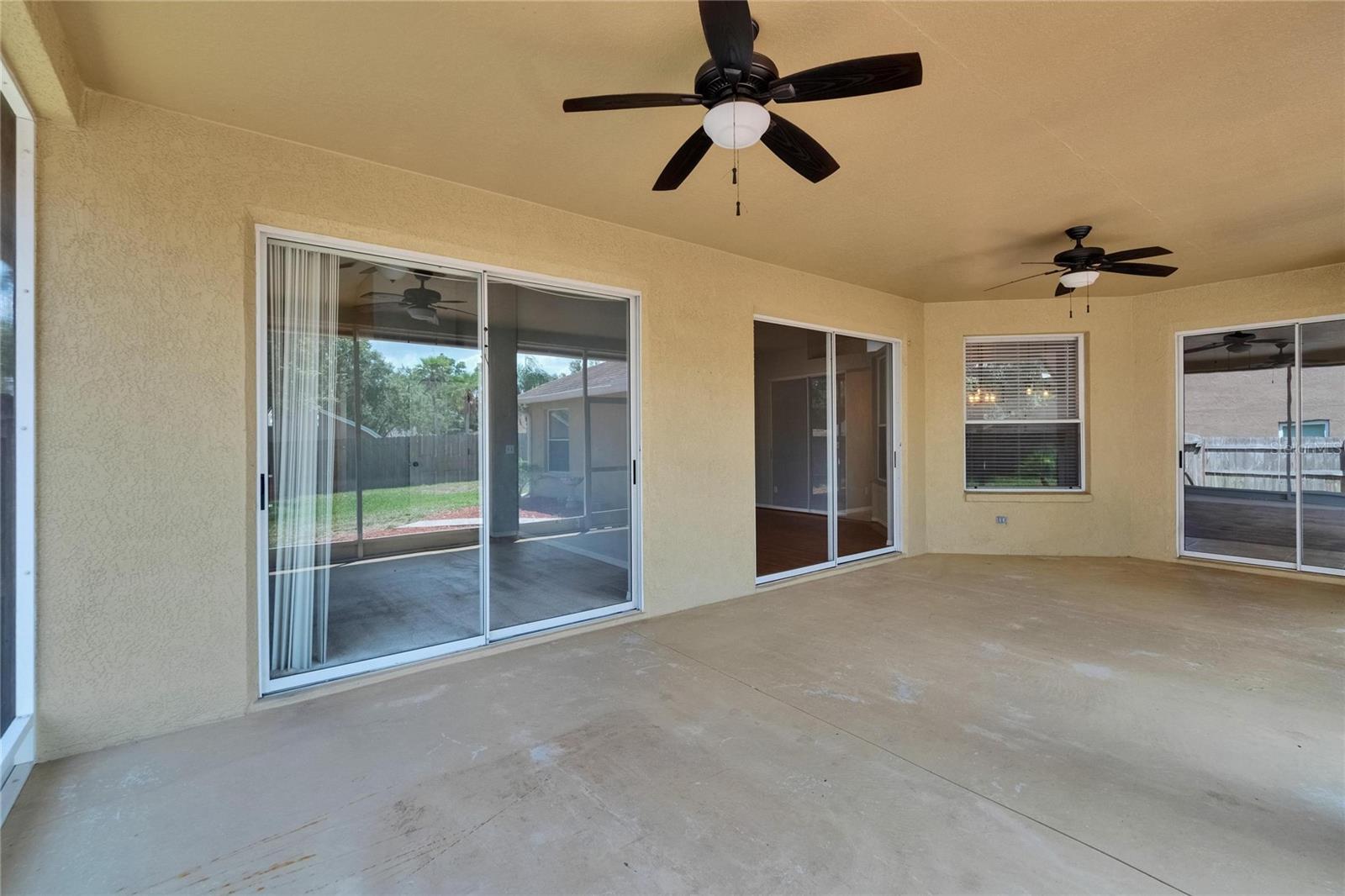 Lanai. From left to Right...Primary Bedroom Sliders, Living Room Sliders, Family Room Sliders.