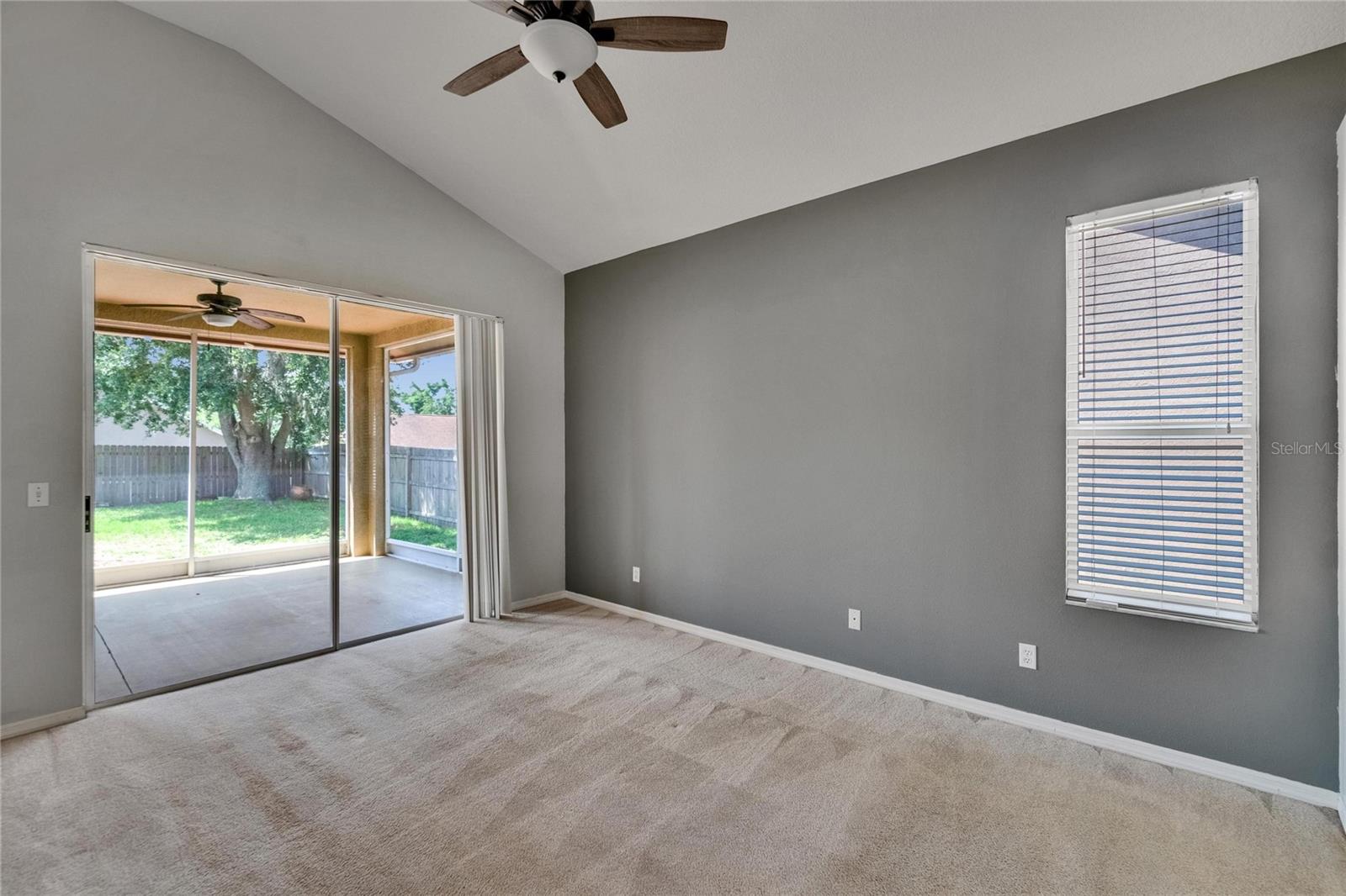 Primary Bedroom.  Sliders to Lanai.