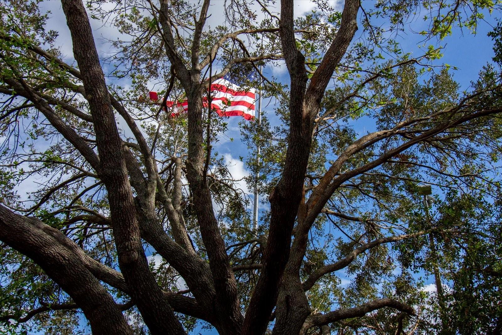 GOD BLESS AMERICA-FLAG IN FRONT OF CLUBHOUSE; ALWAYS FLYING