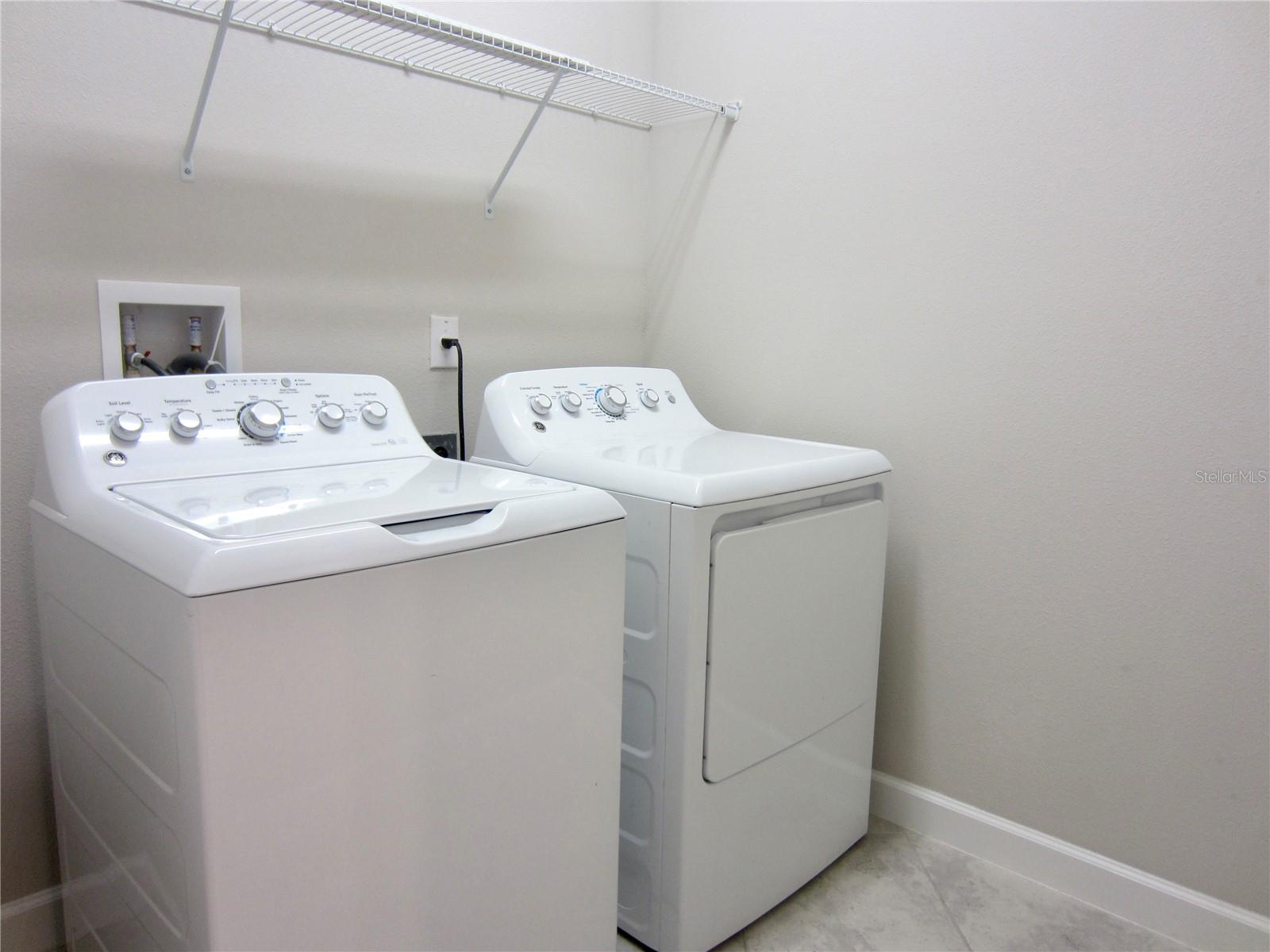 laundry room next to kitchen and Master bathroom
