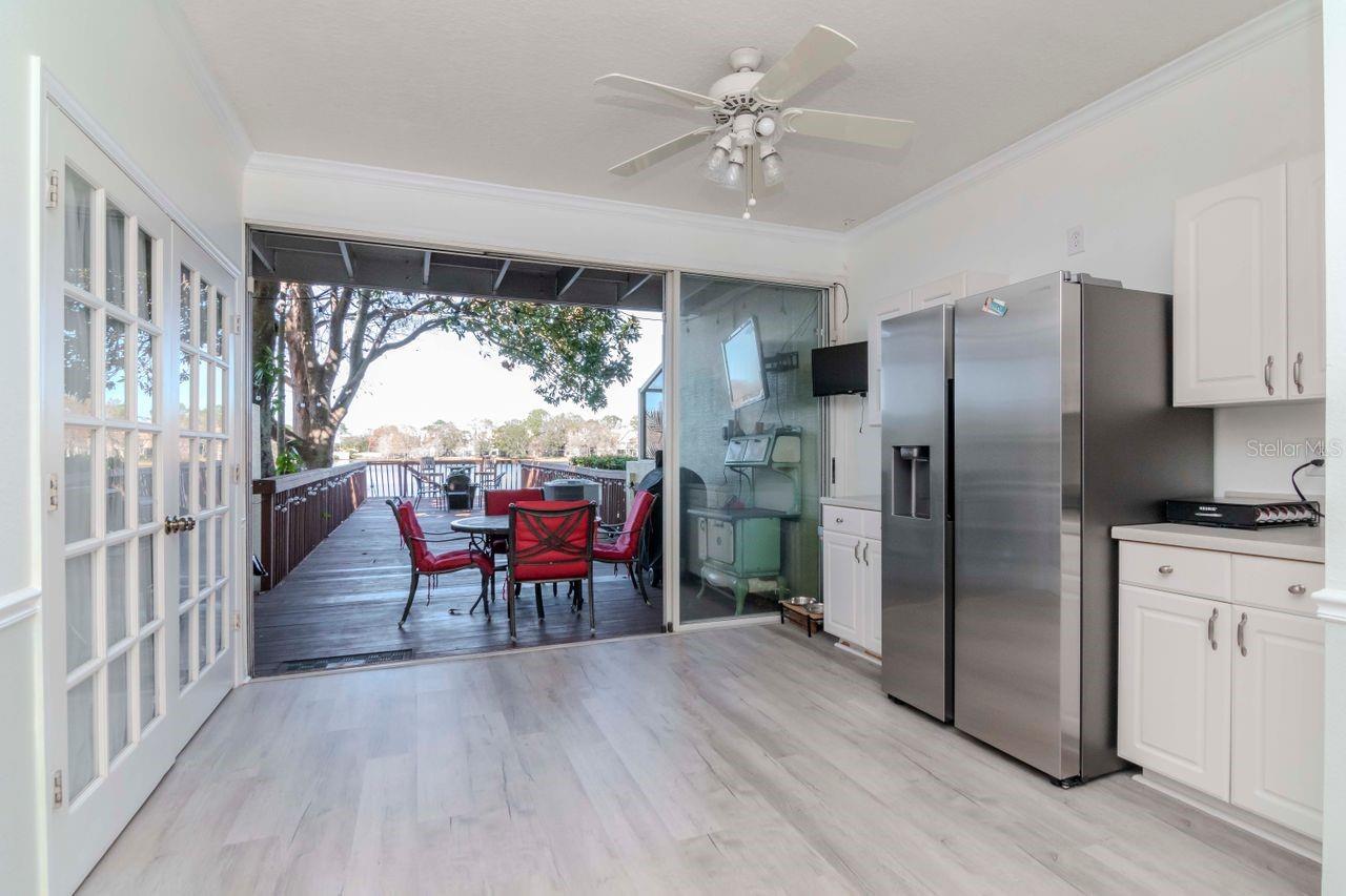 Sliding doors to the dock and double doors open to the laundry area.