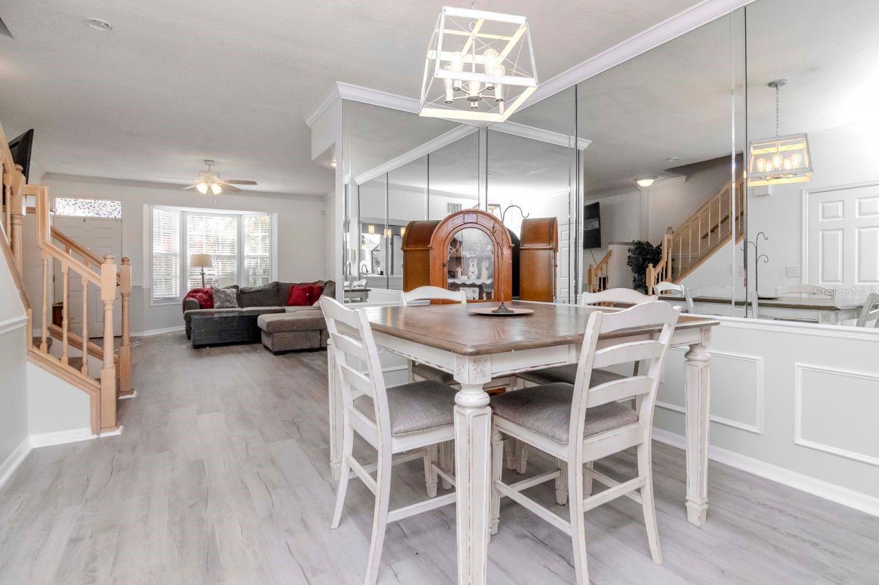 Another angle of dining area and stairs to the 2nd/3rd floors