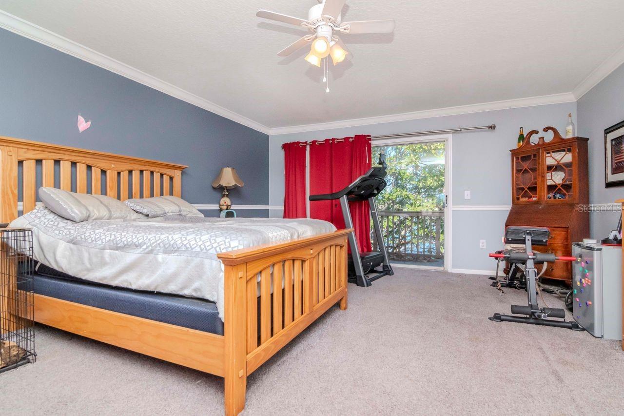 Primary bedroom with view of balcony