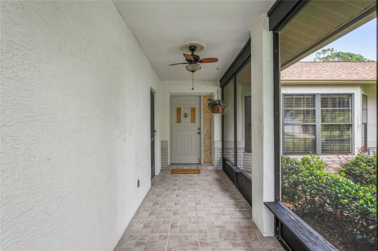 TILED & SCREENED FRONT PORCH
