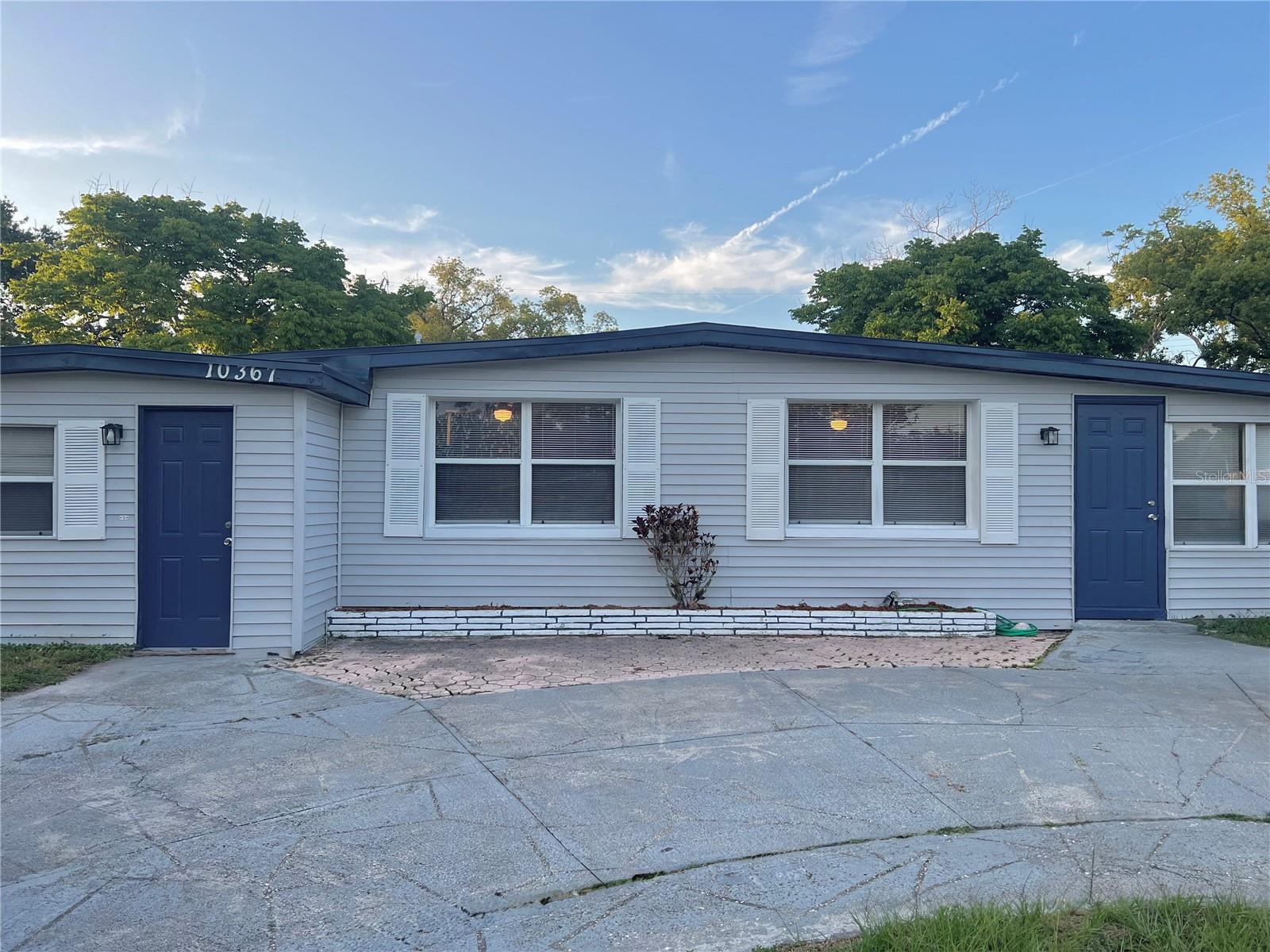 The circular driveway provides ample parking