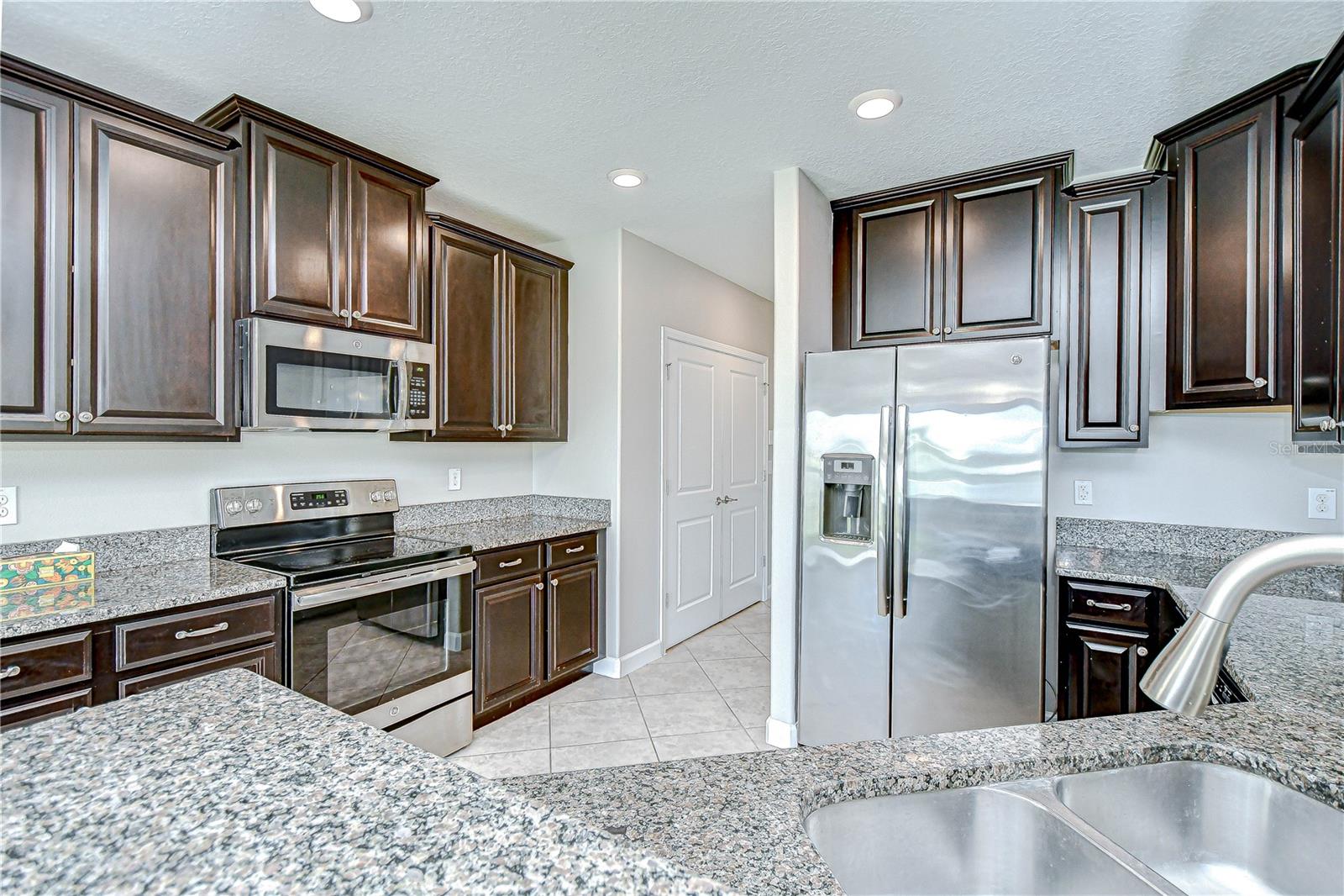 There is breakfast bar seating & stone counters as well!