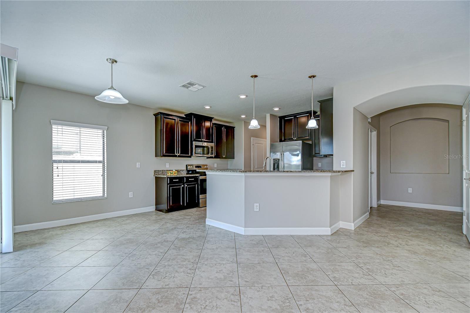 Living and dining room seamlessly connect to a gorgeous kitchen!