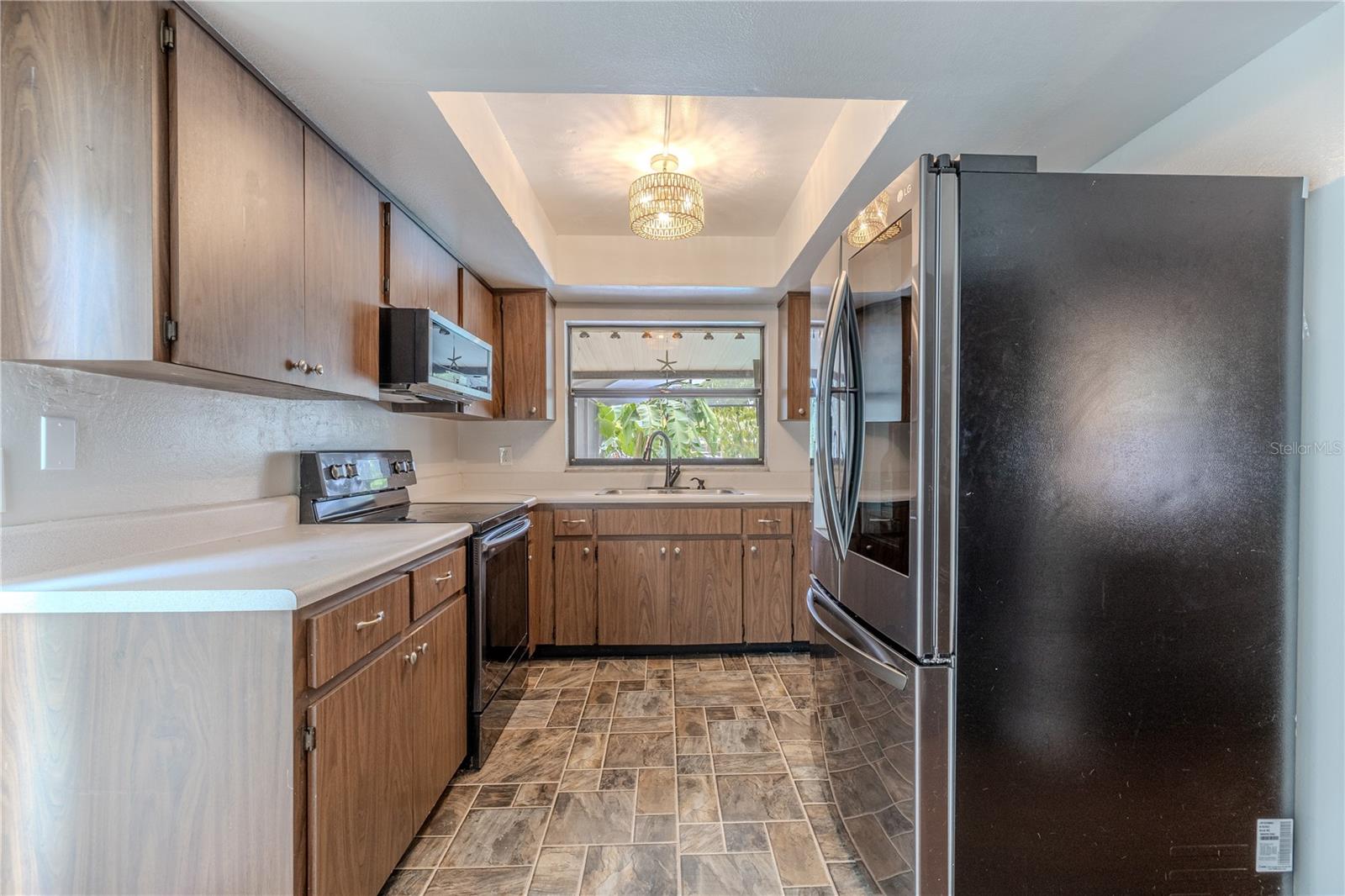 This galley-style kitchen offers a highly functional layout with generous cabinet and counter space, perfect for everyday cooking and entertaining.