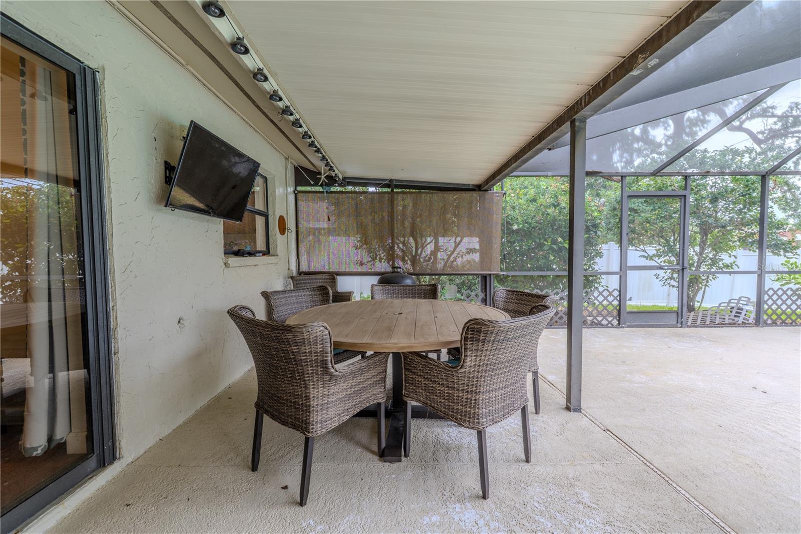 Covered patio in the lanai. Idea for dining alfresco.
