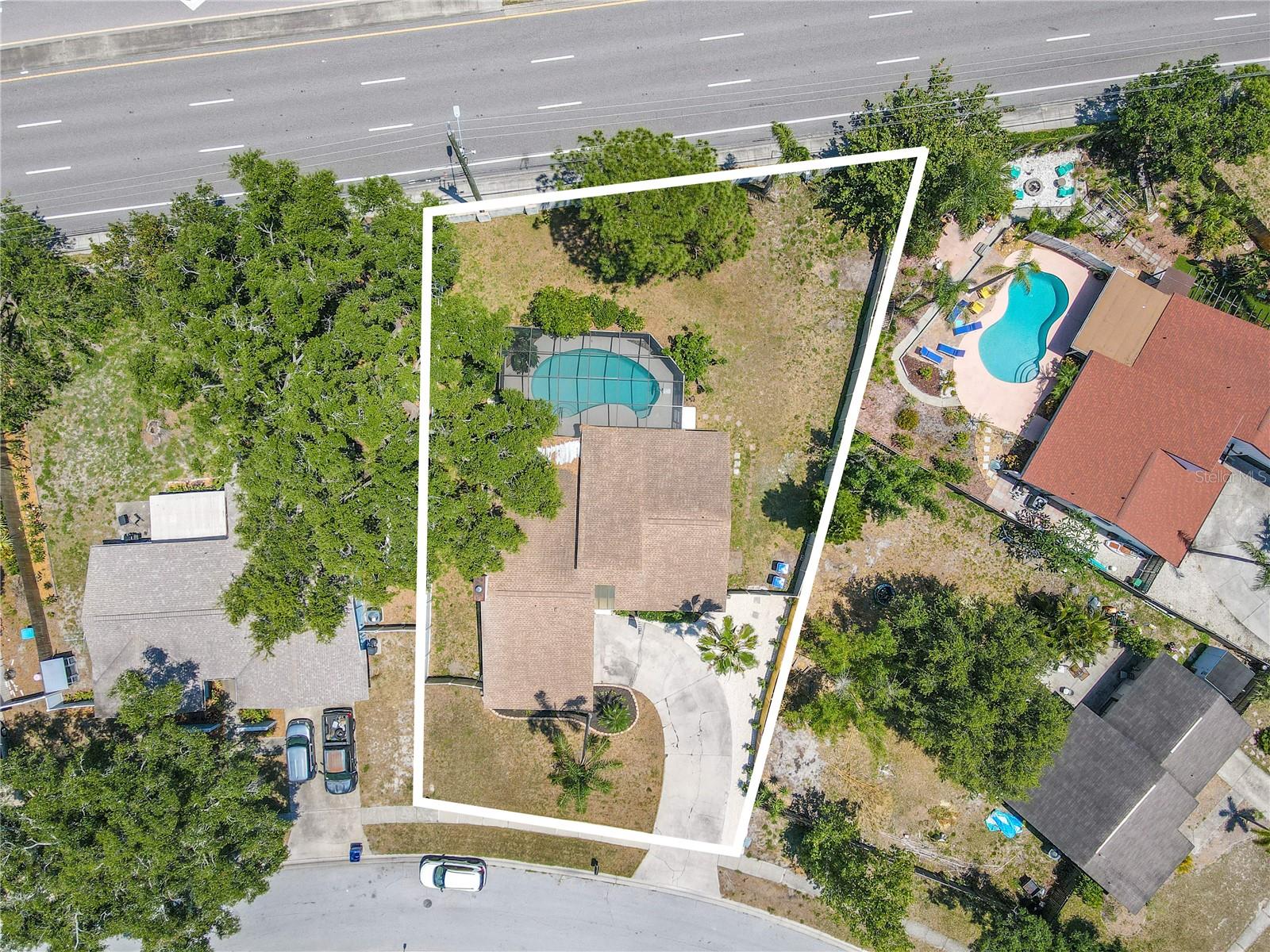 3 bedroom, 2 bath, 2 car garage, Screened-in Lanai with in-ground pool and fenced yard.