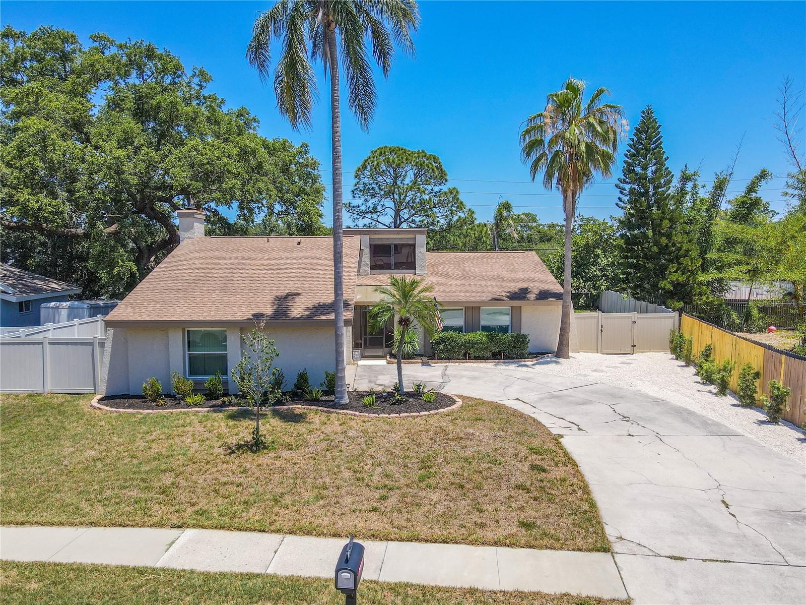3 bedroom, 2 bath, 2 car garage, Screened-in Lanai with in-ground pool and fenced yard.
