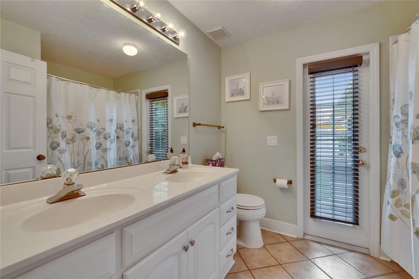 Second bath with door to exterior.