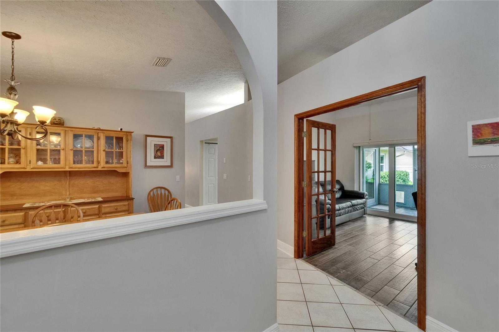 Foyer entry view into office and dining room