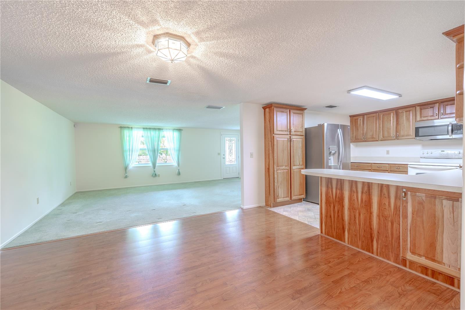 The kitchen is open to the dining and family room.