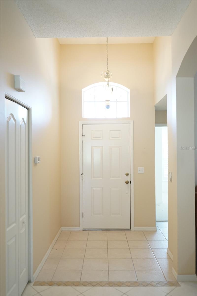 foyer with a coat closet