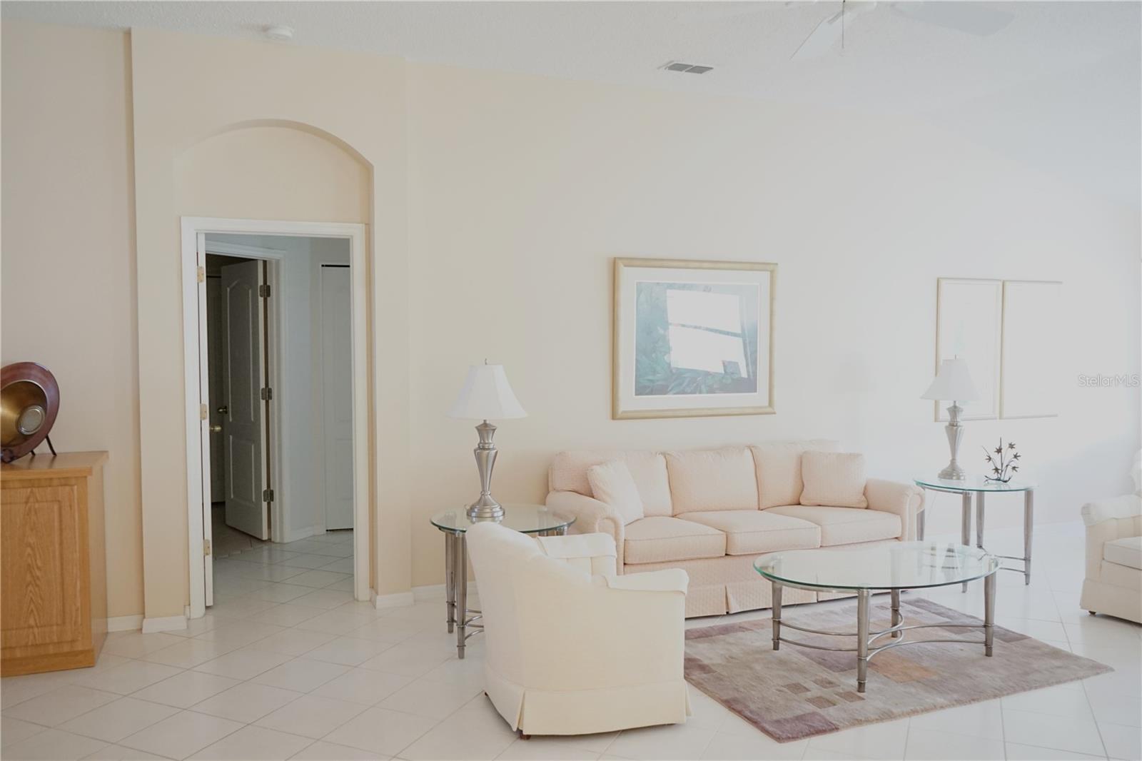 living area with doorway to owners bedroom