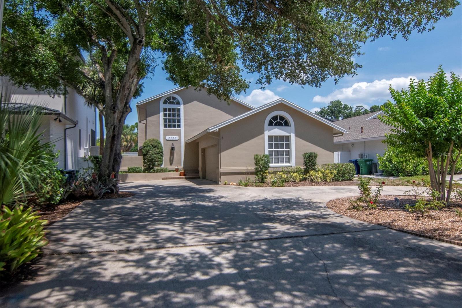 Shaded drive offers cool parking in summer - but if you prefer more grass, remove part of the circular drive and enjoy a large front lawn.