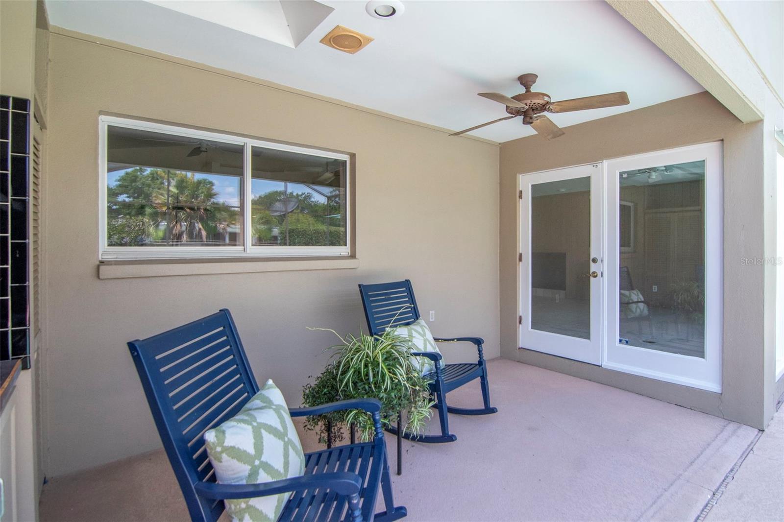 The rear porch is in the screen enclosure so enjoy shaded, bug free relaxation.