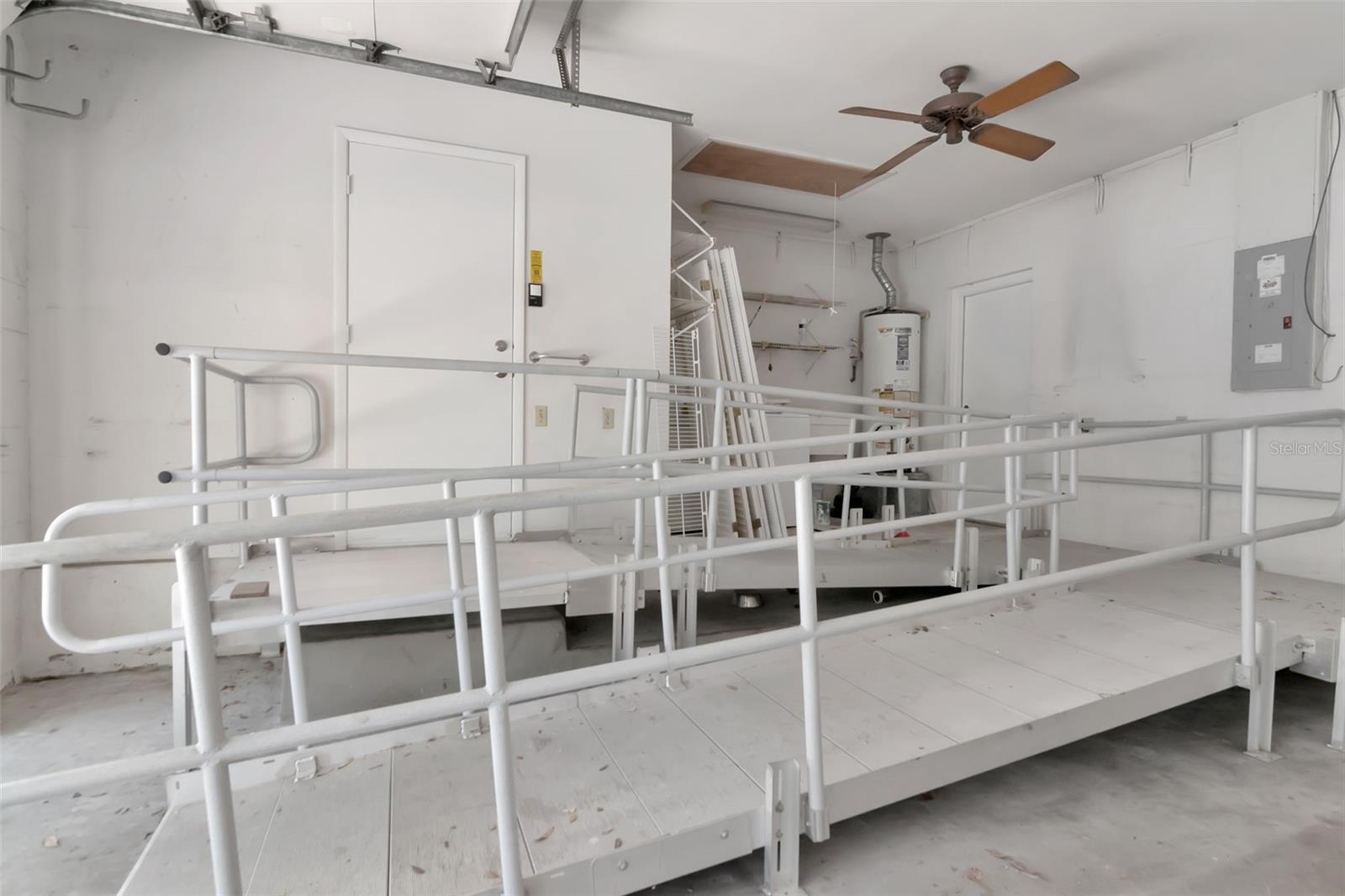Wheelchair ramp in one bay of 2 car garage. (Can be removed.)