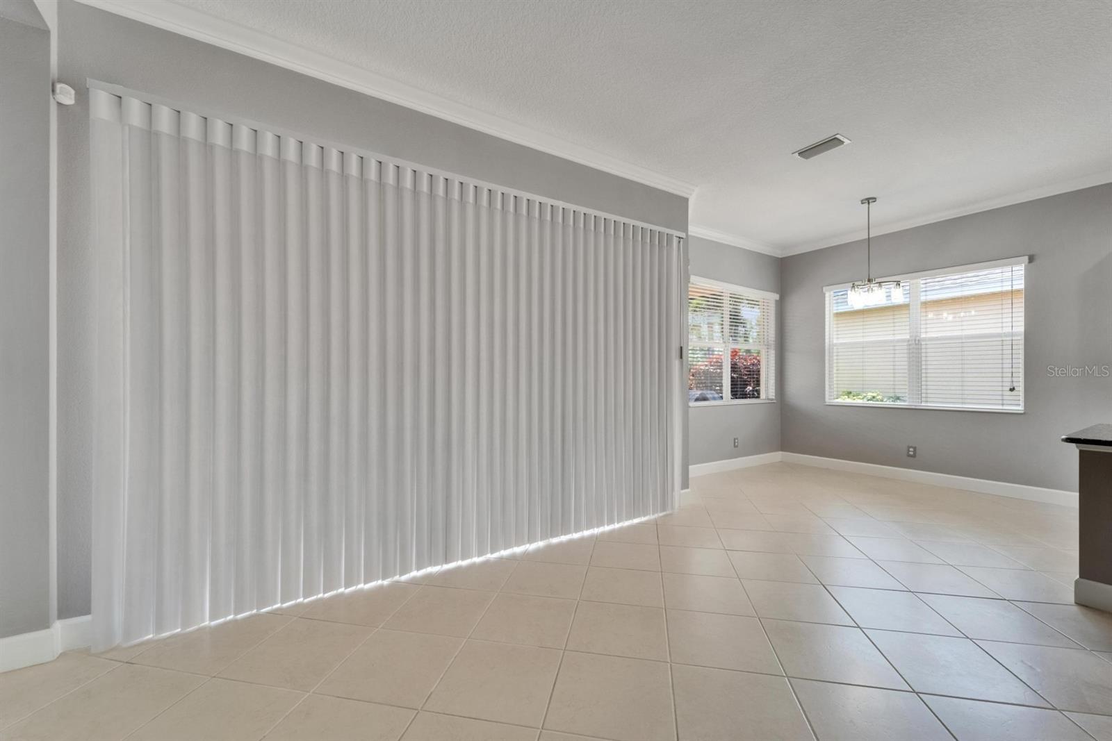 Extended lanai with custom fabric blinds that allows shade and privacy