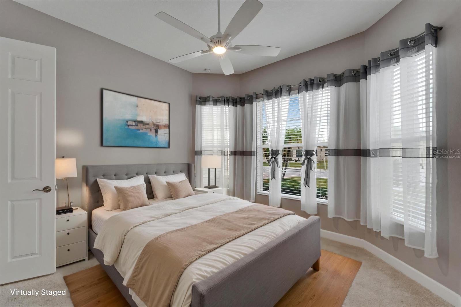 Guest Bedroom is located at opposite end of the home for privacy - Virtually Staged
