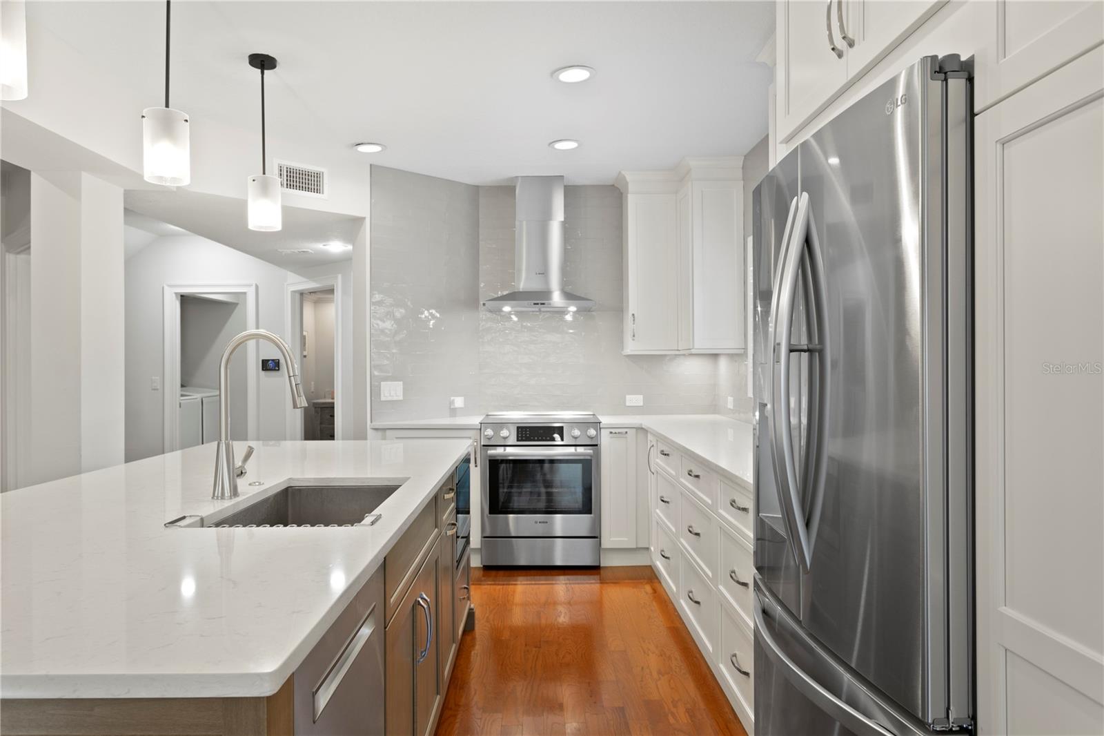 You'll find abundant cabinet storage, and an open layout that flows seamlessly into the living and dining spaces.