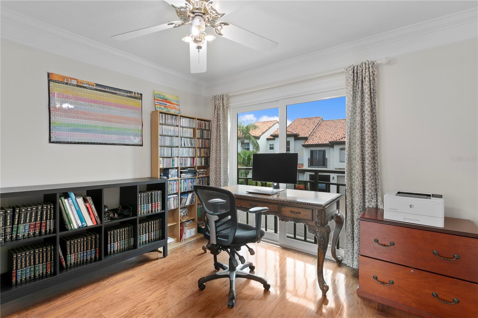 This bedroom is currently being used as an office. It features a nice sized closet with custom closet system.