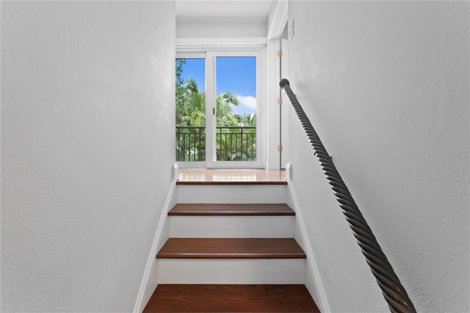 These stairs lead to the private primary suite.