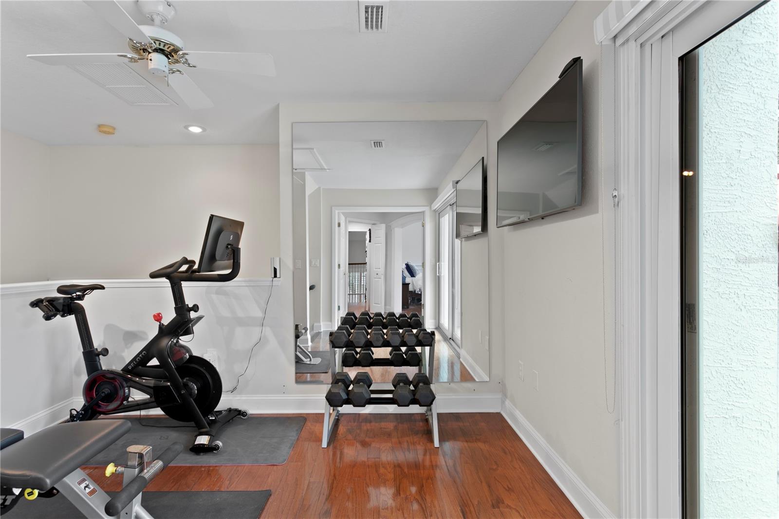 This flexible loft space is currently being used as a home gym.