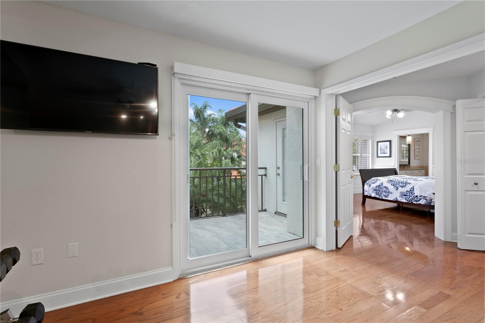Sliding doors lead to the third-floor balcony.